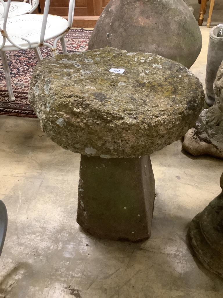 A small staddle stone, 38cm diameter, height 54cm
